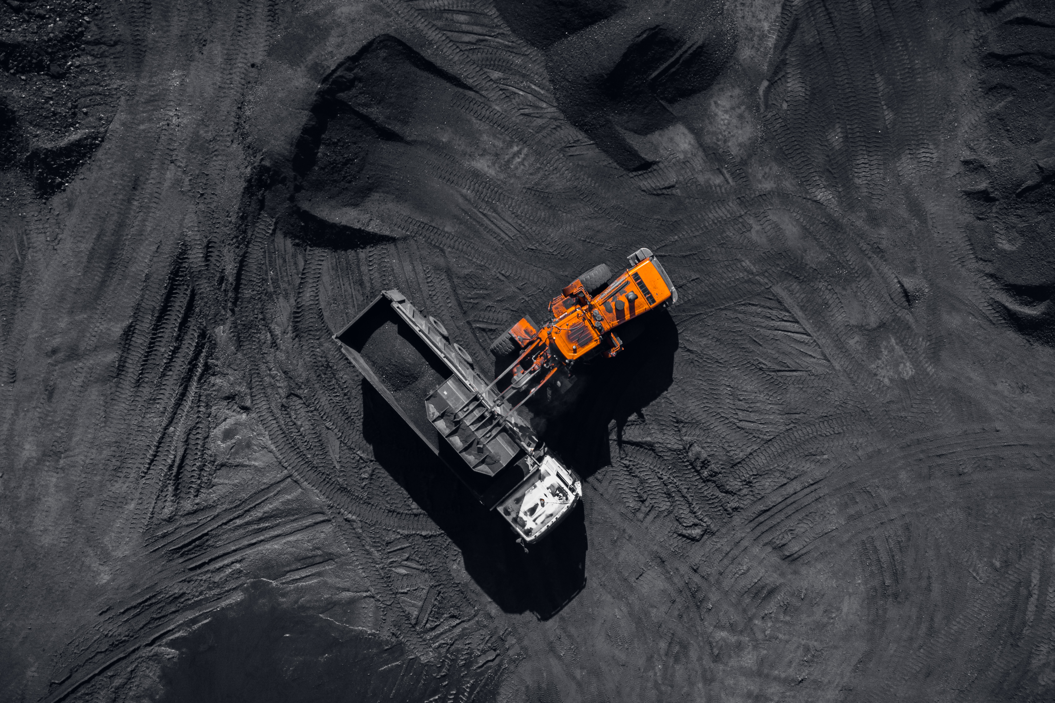 Aerial view of a haul truck loading at a mine